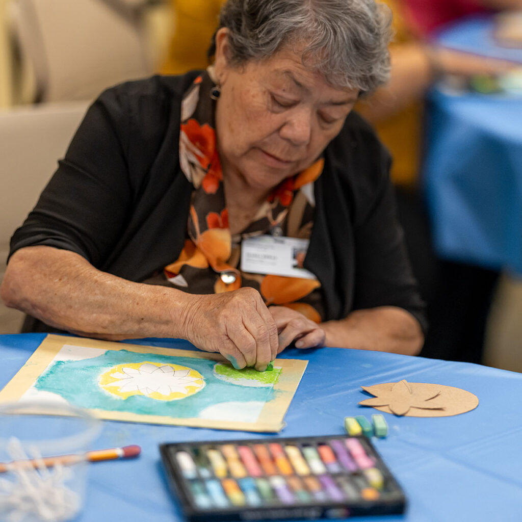 PACE patient participating in art therapy class